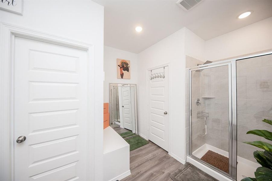 Private water closet & linen closet, plus the seller added a bench area for sitting while dressing, putting on shoes, etc.