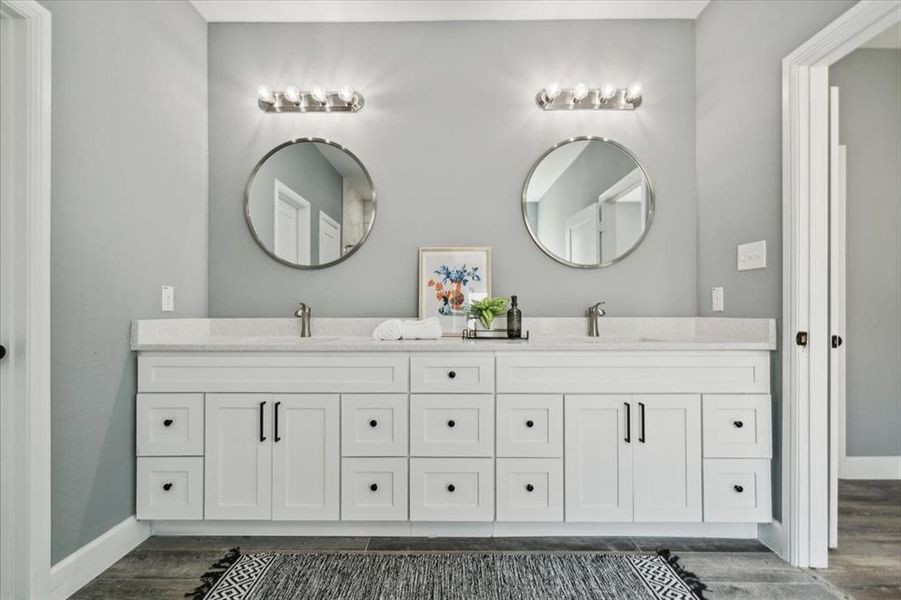 Bathroom featuring vanity and hardwood / wood-style floors