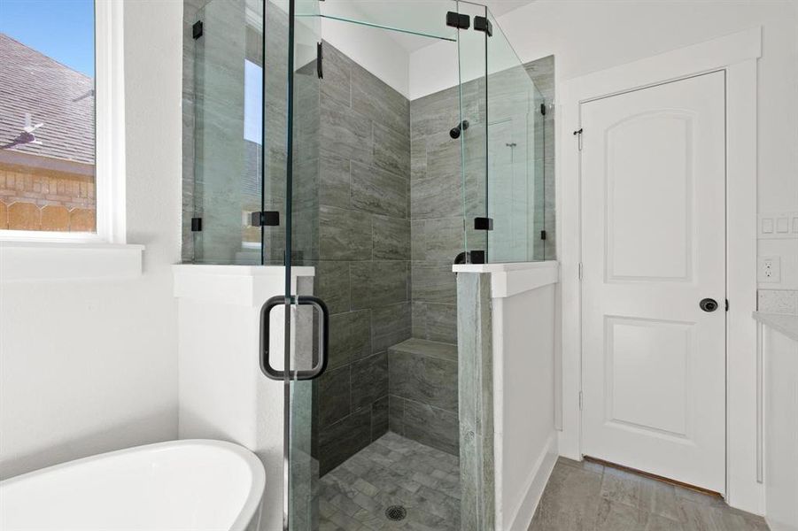 Bathroom with independent shower and bath and a wealth of natural light