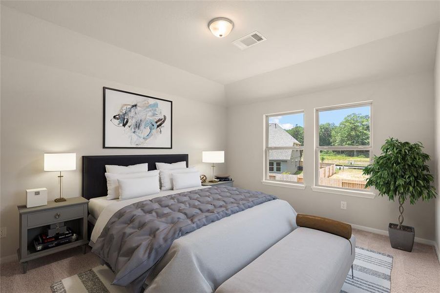 The primary bedroom is generously sized, creating a tranquil and spacious retreat that offers ample room for relaxation. Featuring plush carpet, high ceilings, fresh paint, and large windows that lets in natural lighting throughout the day.