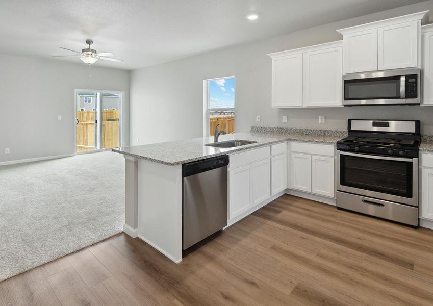 The kitchen of the Arapaho sits adjacent to the family room.