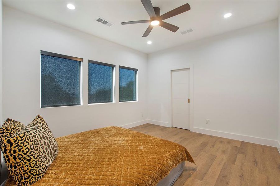 Bedroom with light wood-type flooring and ceiling fan