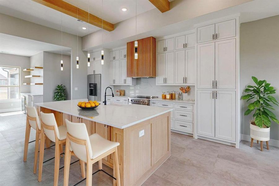 Virtual Staged Kitchen featuring white cabinetry, appliances with stainless steel finishes, and a kitchen island with sink