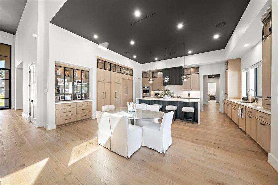 This gorgeous kitchen checks all of the boxes and is perfectly on trend with paneled appliances and elegant European Style white oak floors, the kitchen is both functional and beautiful.