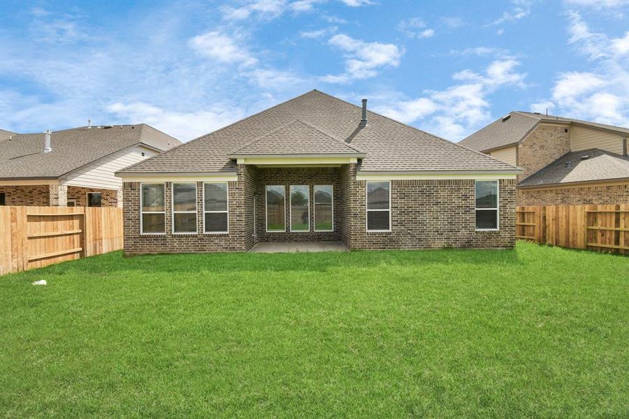 Experience outdoor living at its finest on this expansive covered patio, thoughtfully designed for BBQs and delightful outdoor dining.