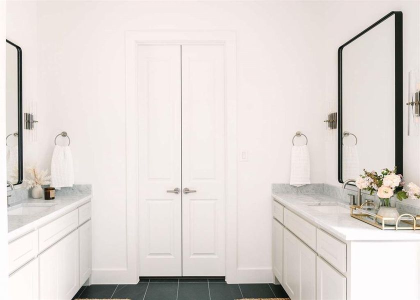 Bathroom with vanity and tile patterned floors