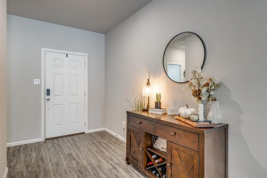 Foyer with light LVP-style flooring