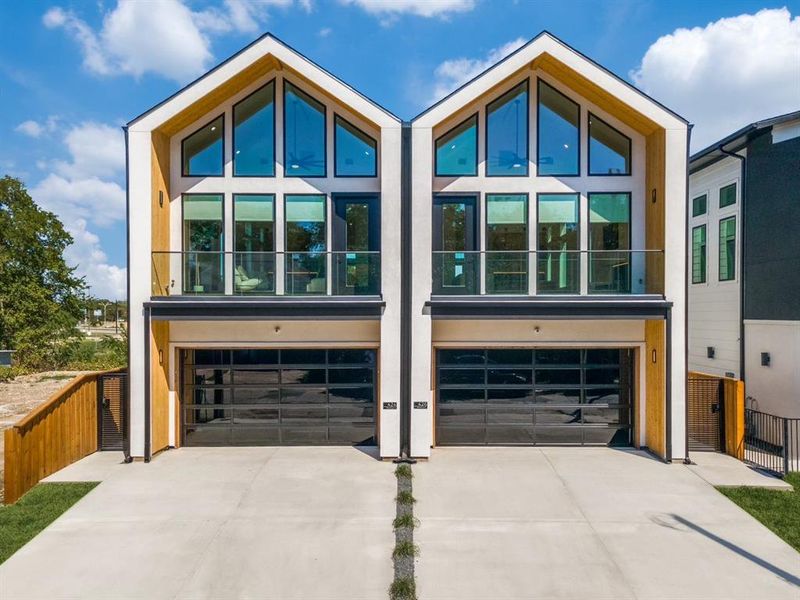 Contemporary home with a garage and a balcony