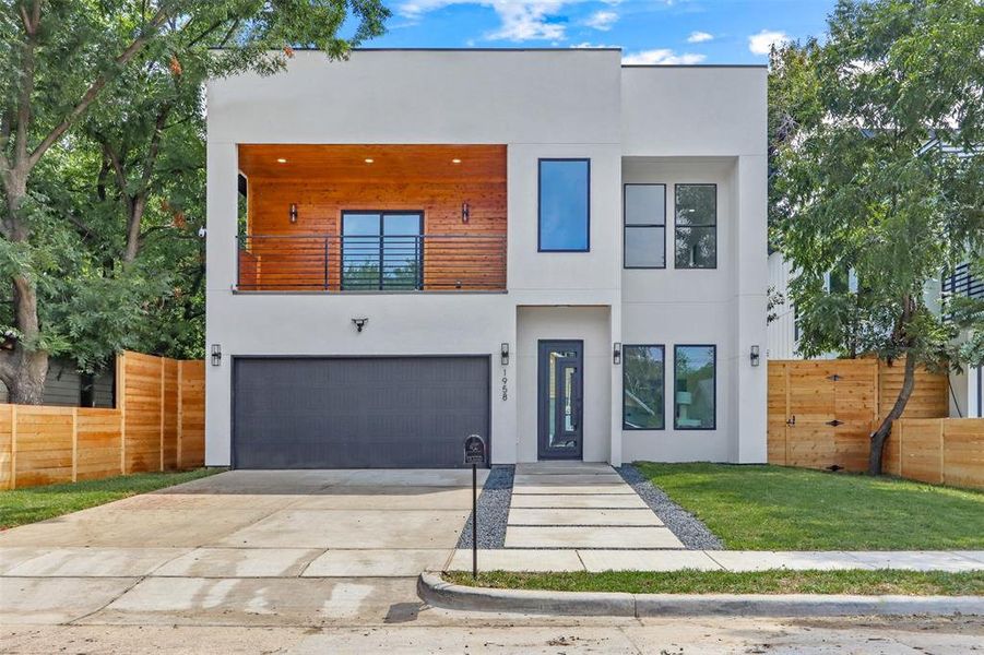 Contemporary house with a front yard and a garage