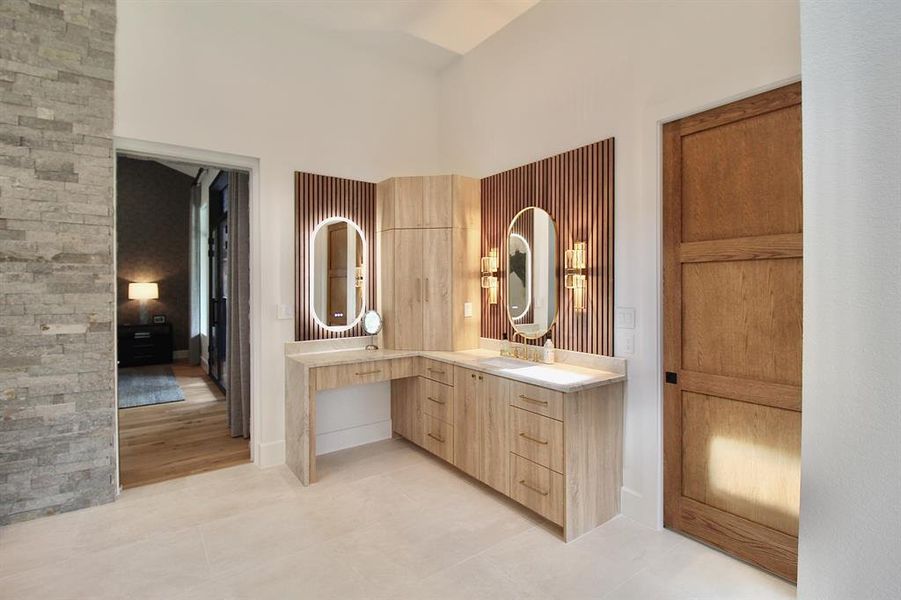 Dreamy primary bath features stunning  vanities.