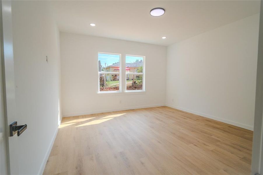 Empty room with light wood-type flooring