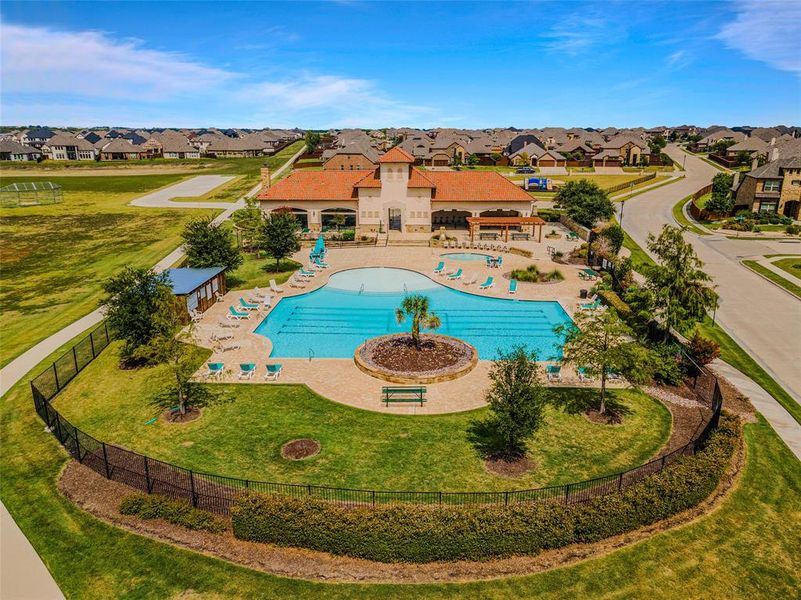 View of swimming pool featuring a patio and a yard