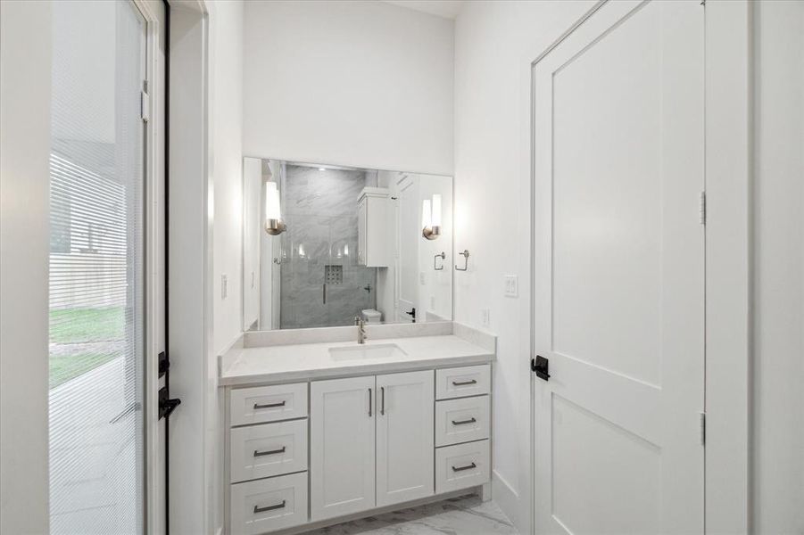 Downstairs bedroom with en suite bath with shower, conveniently opens to lanai.