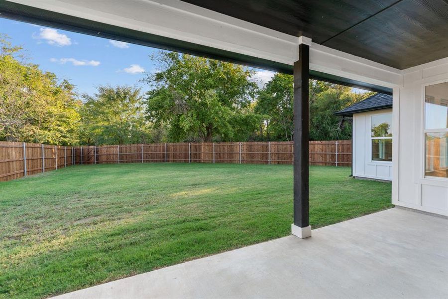 View of yard with a patio