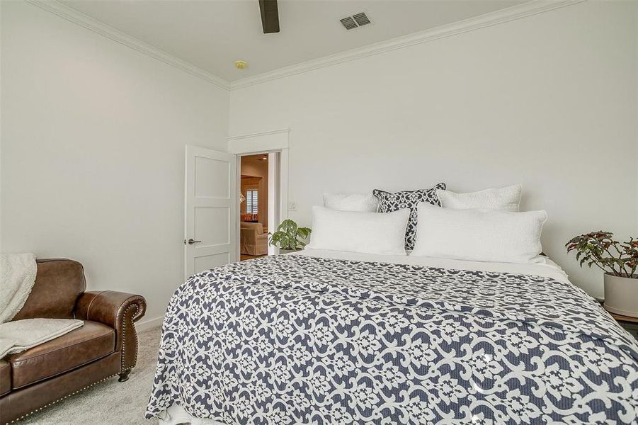 Bright and airy guest bedroom with plush carpet and ample closet space.