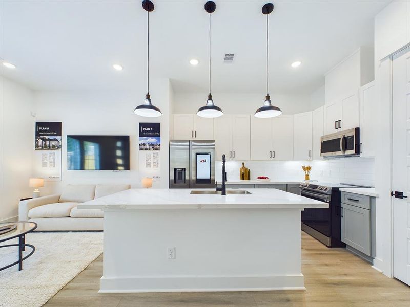 This attractive Kitchen is full of beautiful details. Quartz Countertops, Stainless steel Sink, Stainless Steel Appliances, Recessed Lighting, Undercabinet Lighting, Elegant Cabinetry with Soft Close Drawers and Doors.