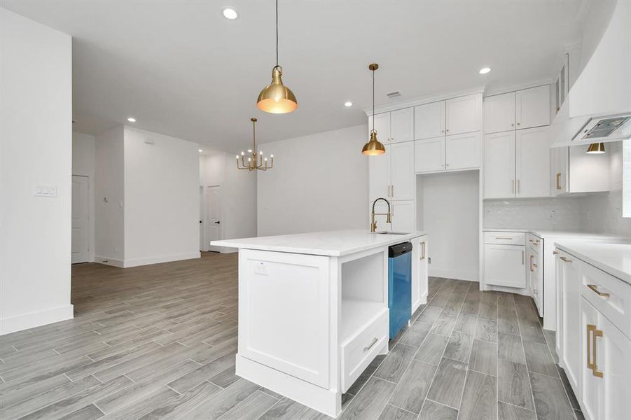 Kitchen and dining combo - this open concept is convenient for entertaining guests or enjoying your everyday meals. Notice the lovely pendant lights to match your mood!