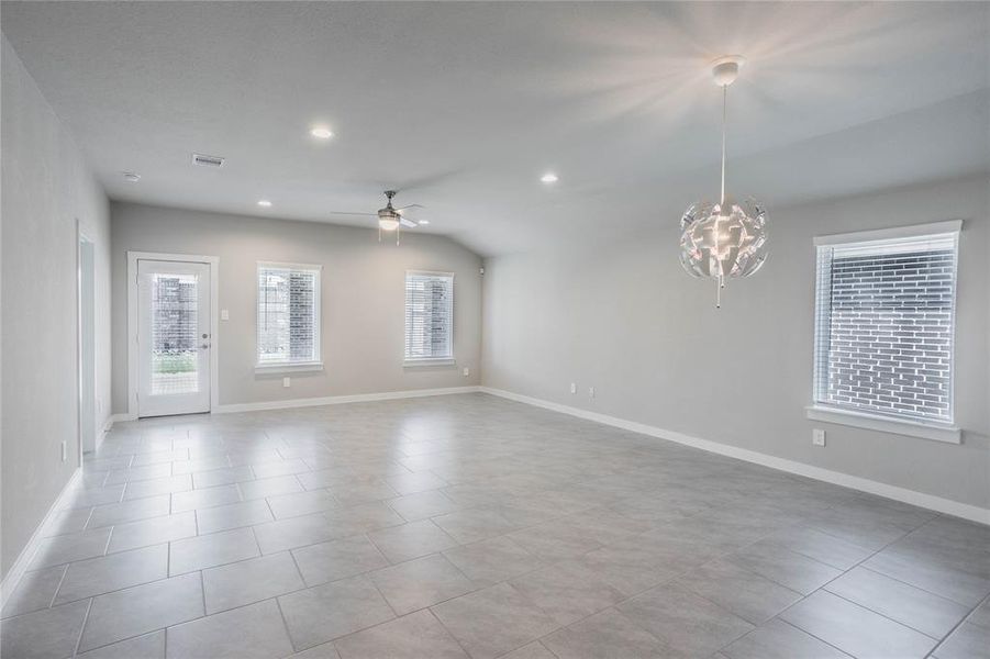 The greatroom is perfect for entertaining w/an open concept living and dining area