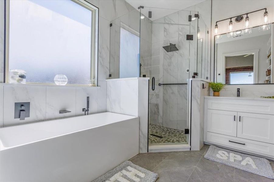 Bathroom with vanity and plus walk in shower