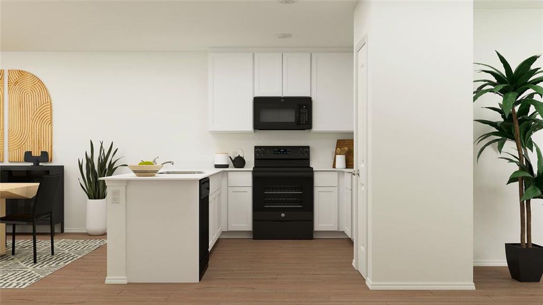 Kitchen with white cabinets, kitchen peninsula, light wood-type flooring, black appliances, and sink