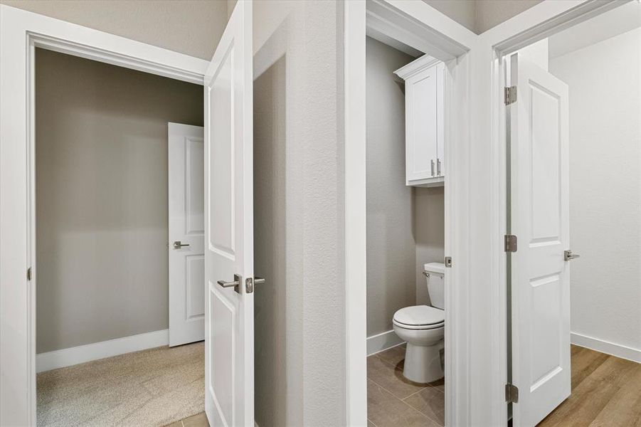 Bathroom featuring toilet and hardwood / wood-style floors