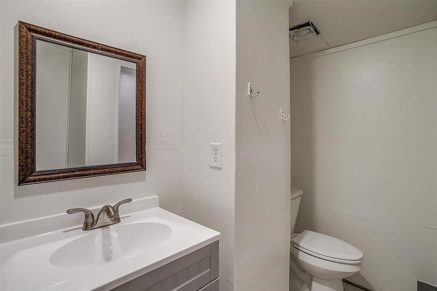 Bathroom featuring toilet and vanity