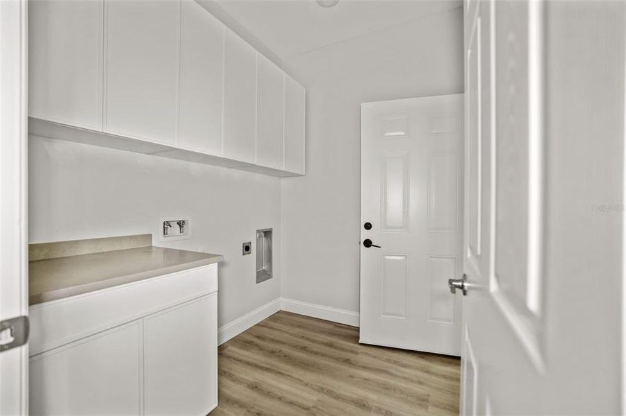Staged Laundry Room of 2144 43rd Terrace that is mirror image of this property