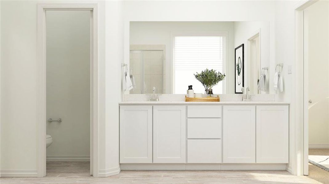 Bathroom featuring hardwood / wood-style flooring, double sink vanity, and toilet