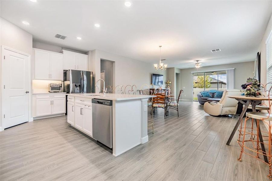 Beautiful tile plank flooring throughout enite home