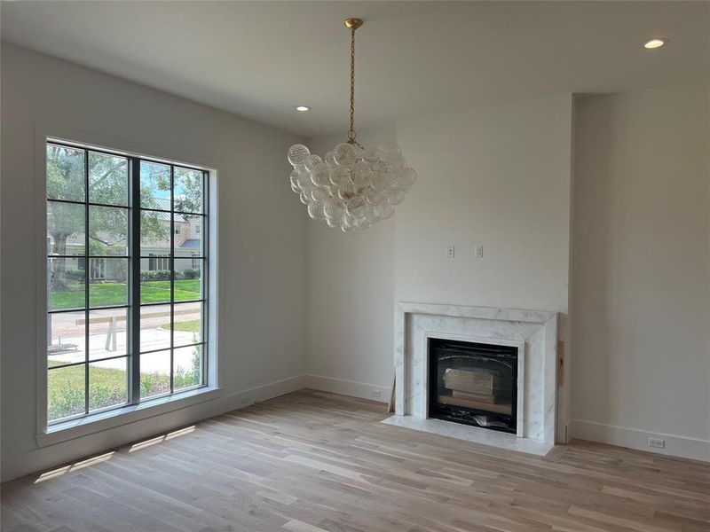 Dining room with gas fireplace and dolomite mantel.