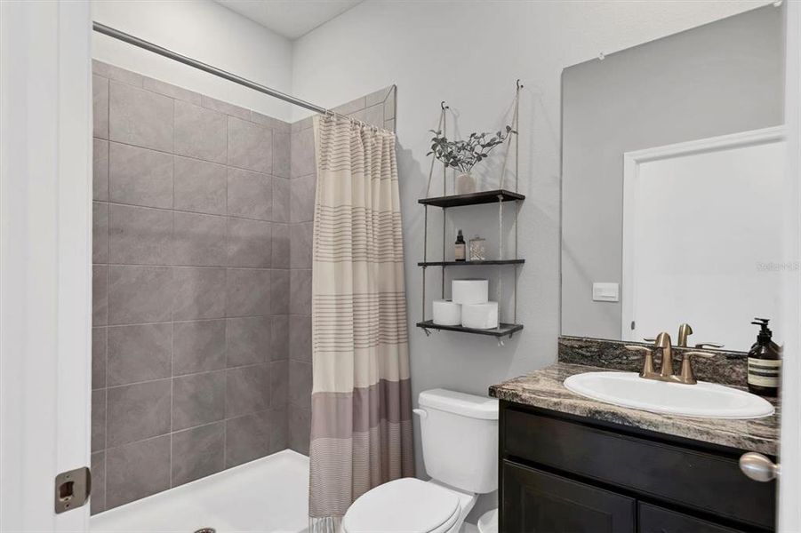 First floor full bath has granite counters and a walk in shower!