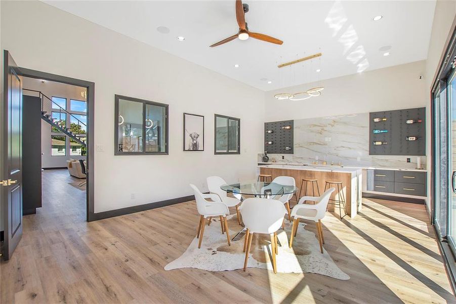 Dining room featuring ceiling fan and light hardwood / wood-style floors