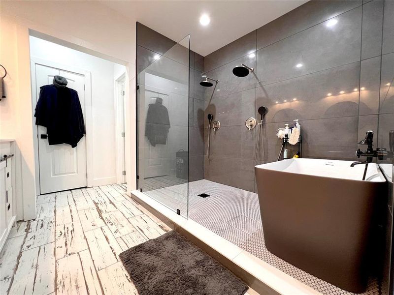 Master Bathroom featuring separate shower and tub