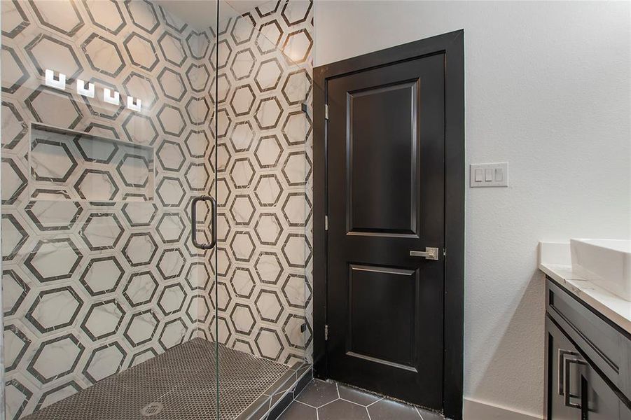 Bathroom featuring vanity and walk in shower