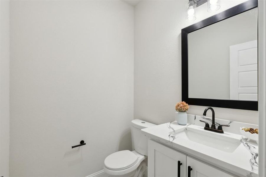 Bathroom with vanity and toilet