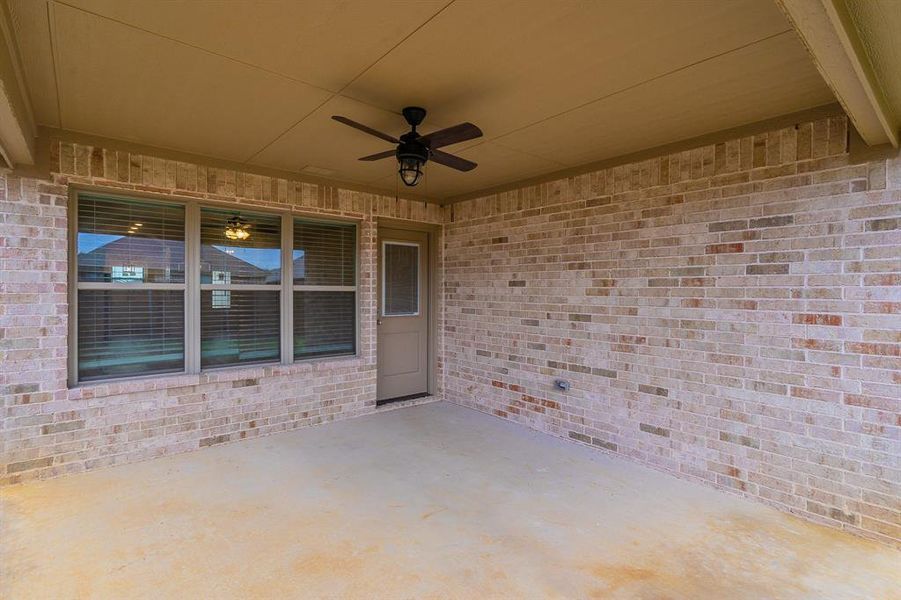 View of patio featuring ceiling fan