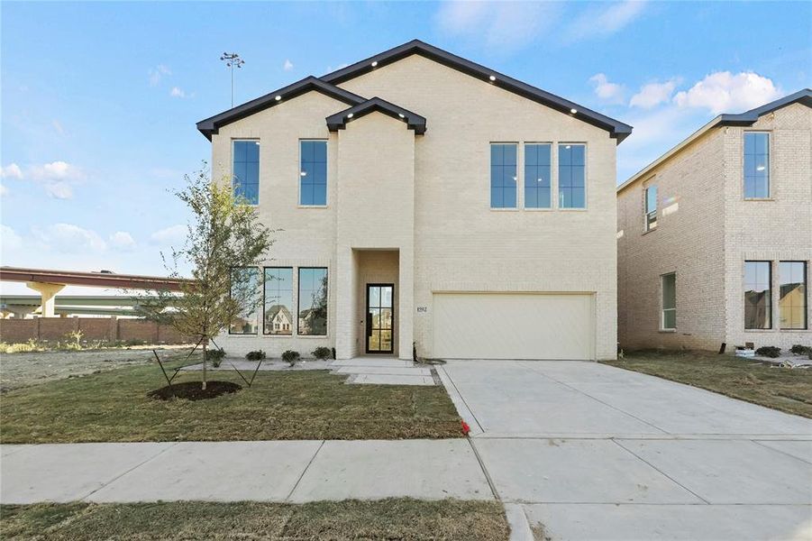 View of front of home featuring a garage