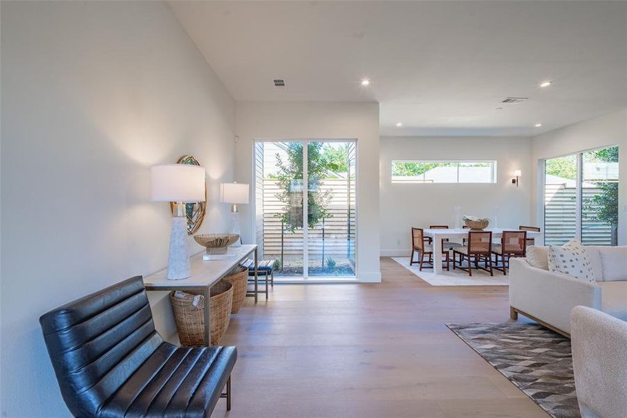 Sitting room featuring a wealth of natural light and light wood-type flooring