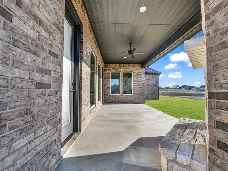 View of patio featuring ceiling fan