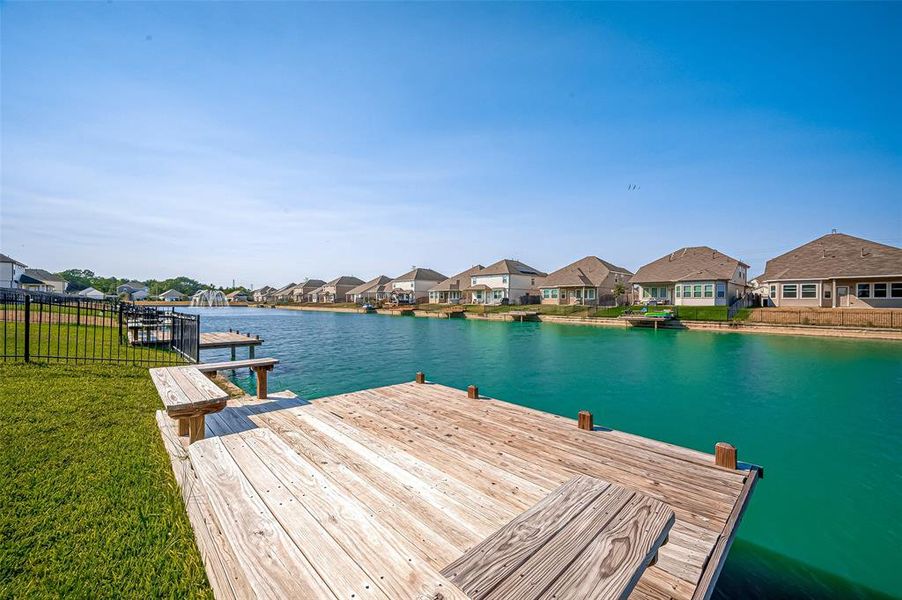 The pier extends gracefully over the water, offering a perfect spot to relax and take in the views. With its sturdy wooden planks, it's ideal for boating or simply enjoying the tranquil ambiance of the lake.