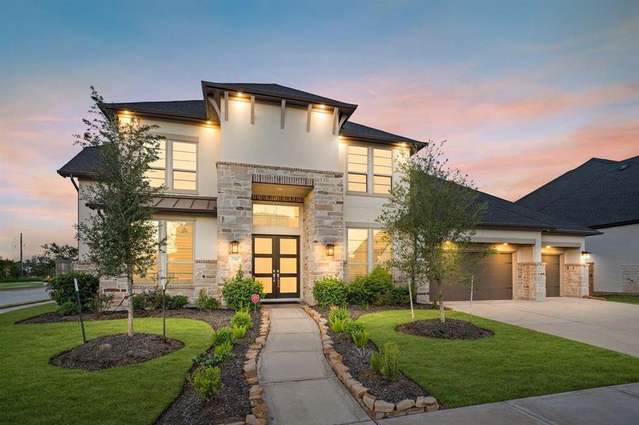 The stunning exterior of 2510 Fountain Cove Lane captivates with its commanding curb appeal.