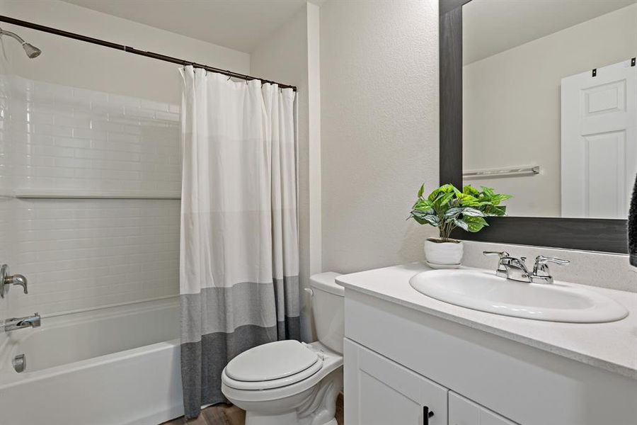 Located in the heart of the lower level, the full bathroom provides central access and convenience.