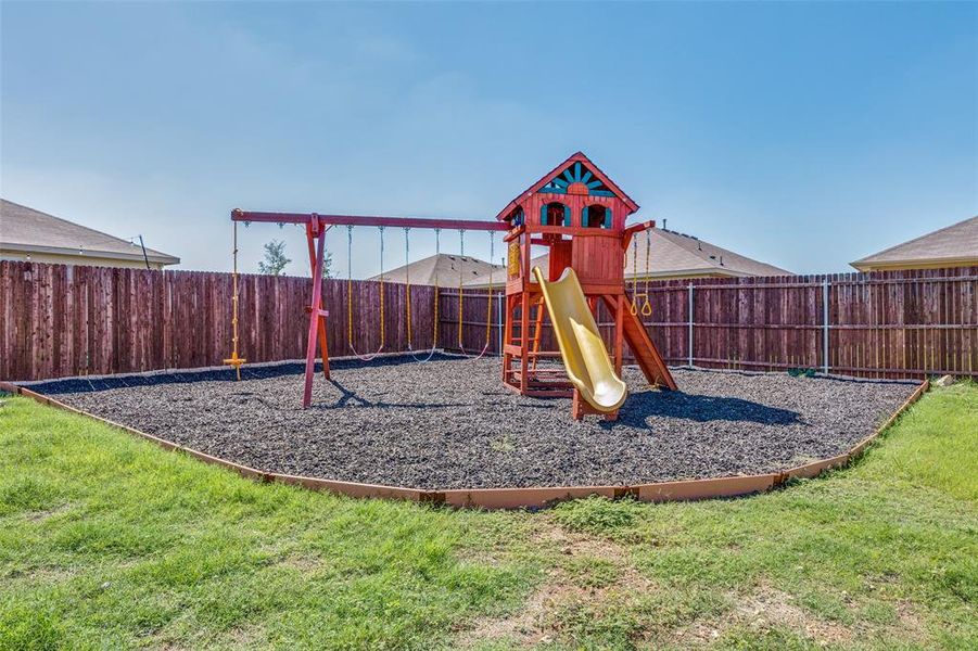 View of playground with a yard