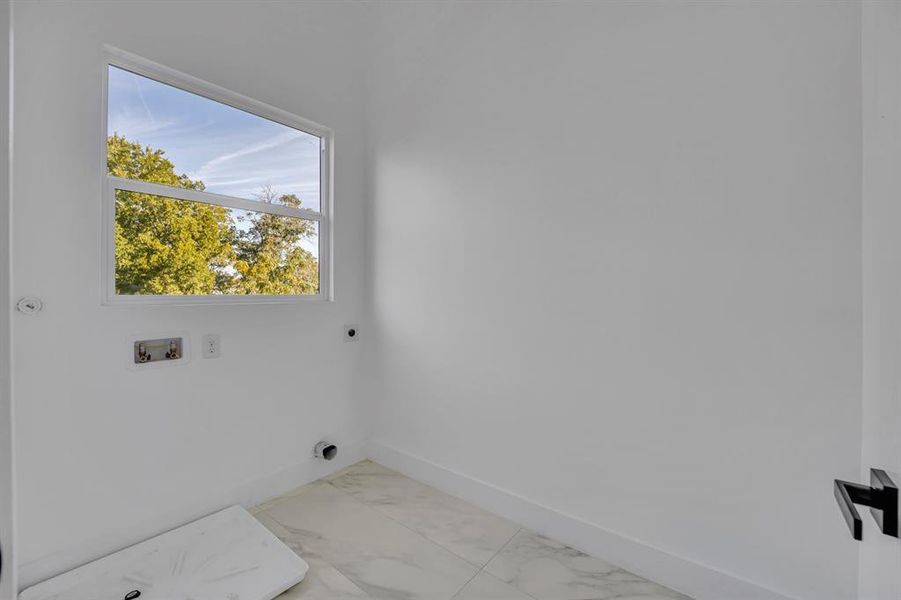 Laundry room featuring washer hookup and electric dryer hookup