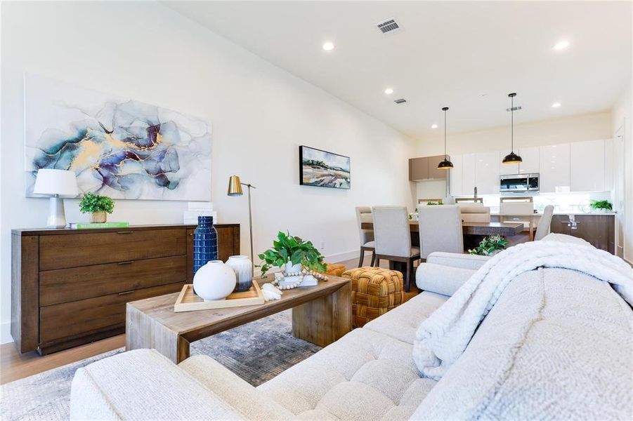 Living room with light hardwood / wood-style floors