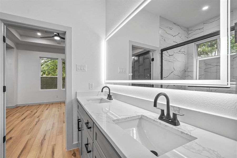 Bathroom with vanity and hardwood / wood-style flooring