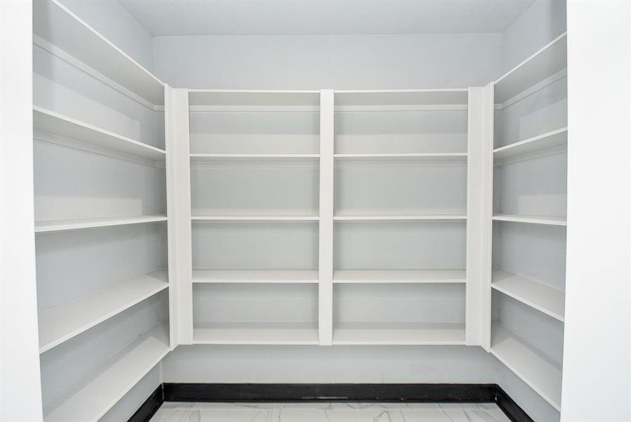 Additionally, there's a spacious pantry for all your storage needs, ensuring everything has its place.