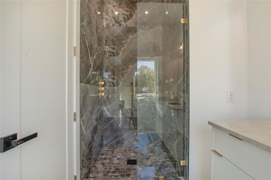 Bathroom with walk in shower and vanity