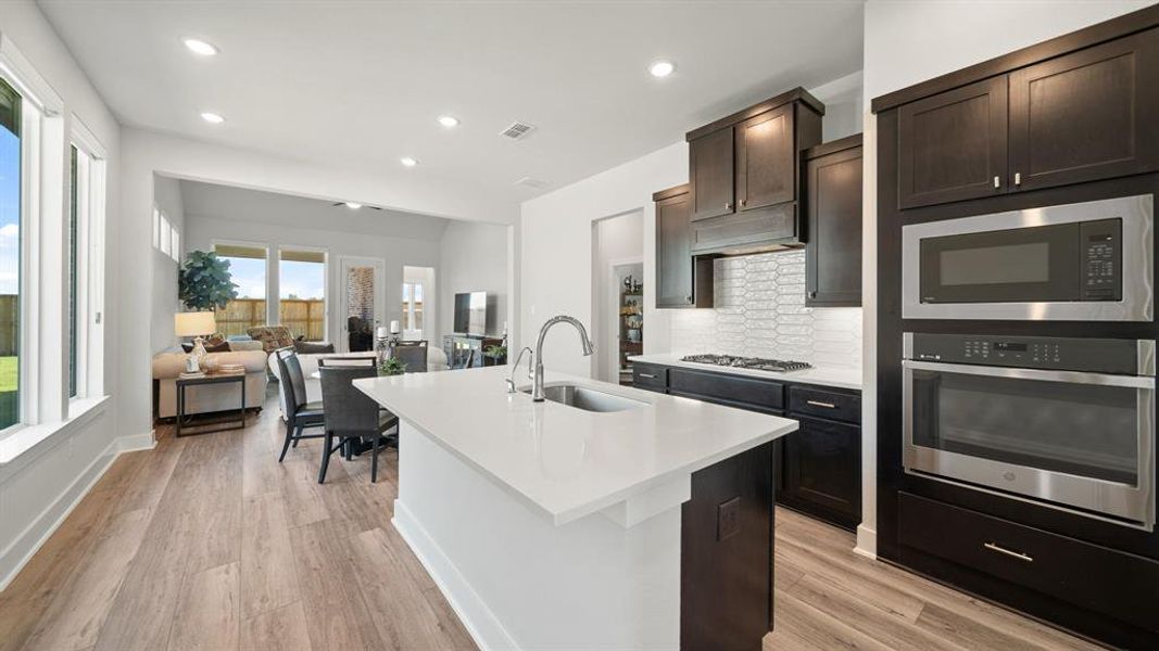 This kitchen will not disappoint! There is plenty of storage and counterspace making this kitchen every chef's dream! It opens to the family room and dining area making it perfect to host any event or holiday!