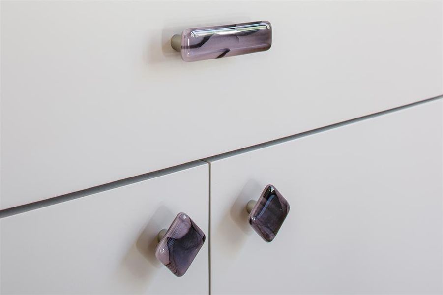 Unique hardware to match the Lilac marble wall